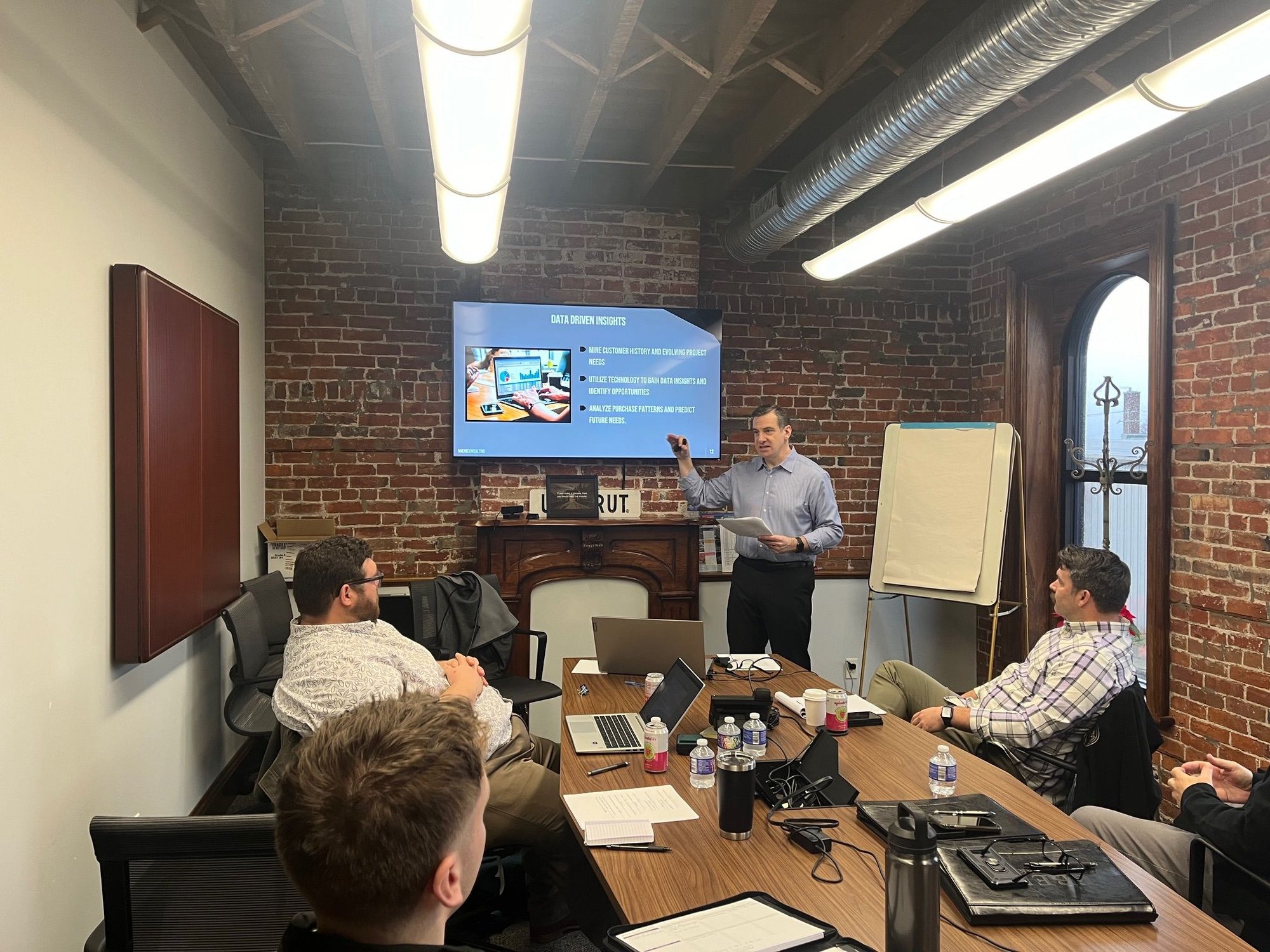 consultant leading training session to sales team.